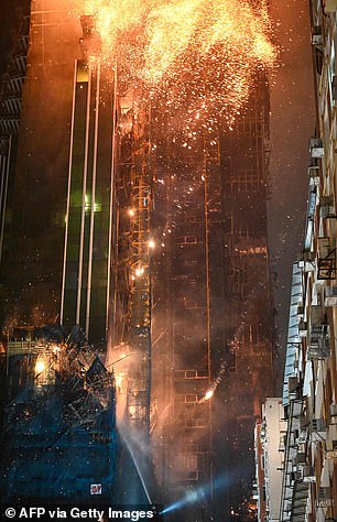News: Huge fire engulfs Hong Kong skyscraper in busy shopping district