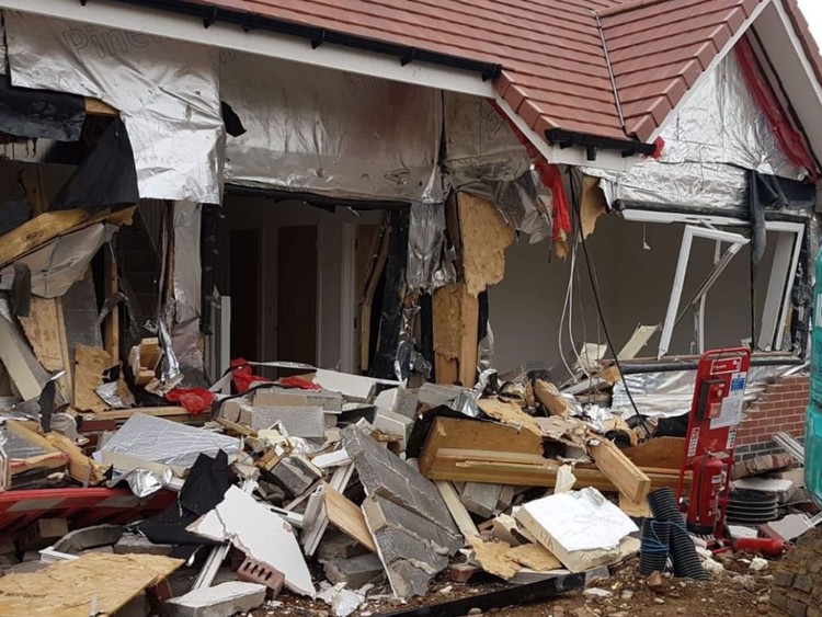 News: Builder charged after new houses wrecked with a digger
