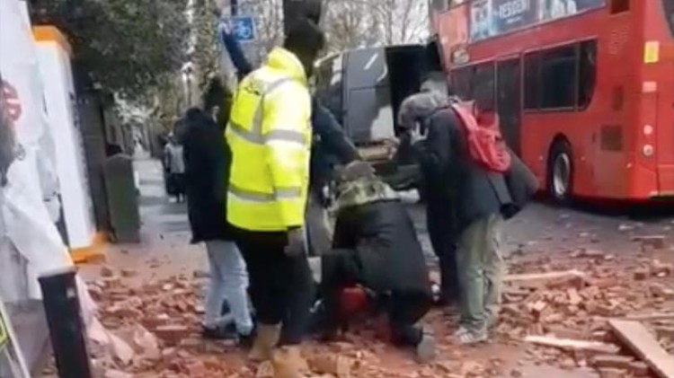 News: Woman hit by falling bricks fights for her life